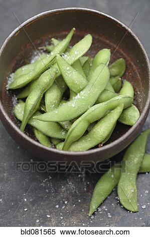 Stock Photography - Close up of salted edamame in bowl. Fotosearch