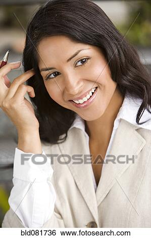 Close up of smiling Hispanic businesswoman View Large Photo Image Stock Photograph - Close up of smiling Hispanic businesswoman. Fotosearch