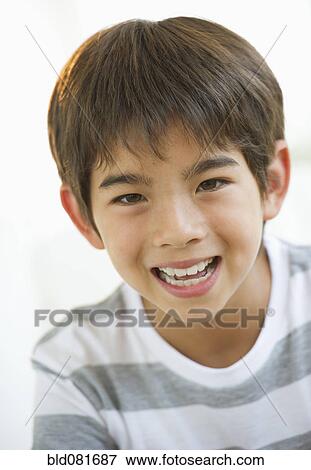 Close up of smiling mixed race boy View Large Photo Image Stock Photo - Close up of smiling mixed race boy. Fotosearch
