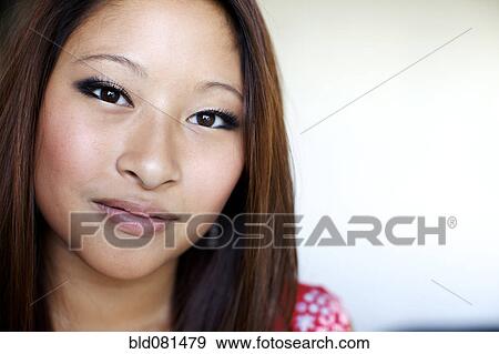 Close up of smiling mixed race teenage girl View Large Photo Image Stock Photo - Close up of smiling mixed race teenage girl. Fotosearch
