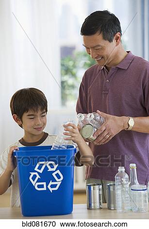 Father and son recycling plastic bottles and tin cans View Large Photo Image Stock Image - Father and son recycling plastic bottles and tin cans. Fotosearch