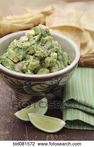 Guacamole and limes View Large Photo Image Stock Image - Guacamole and limes. Fotosearch