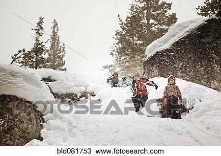 Stock Image - Kids playing in snow. Fotosearch