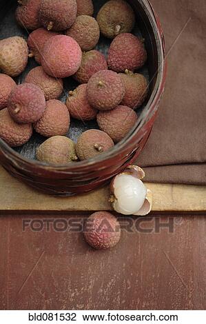 Stock Image - Lychee in basket. Fotosearch