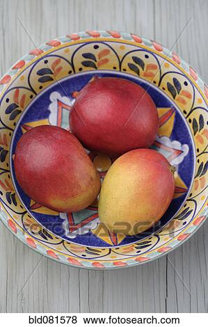 Mexican mangoes in bowl View Large Photo Image Stock Photo - Mexican mangoes in bowl. Fotosearch