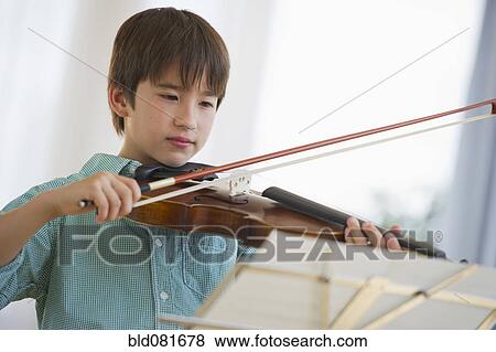Mixed race boy playing violin View Large Photo Image Stock Photo - Mixed race boy playing violin. Fotosearch