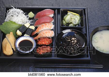 Stock Image - Nigiri sushi and miso soup. Fotosearch