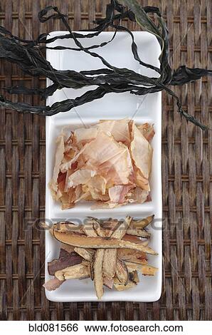 Stock Photograph - Shaved fish and seaweed on platter. Fotosearch