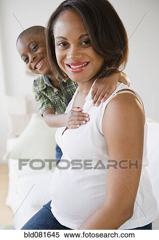 Stock Photography - Smiling Black mother and son. Fotosearch