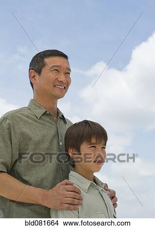 Smiling father and son View Large Photo Image Picture - Smiling father and son. Fotosearch