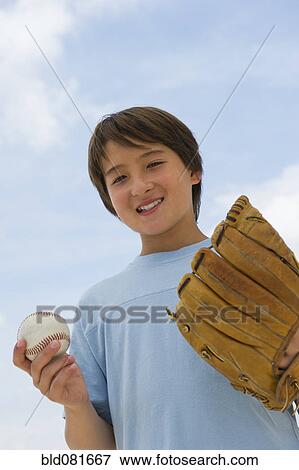 Smiling mixed race boy with baseball and mitt View Large Photo Image Stock Photo - Smiling mixed race boy with baseball and mitt. Fotosearch