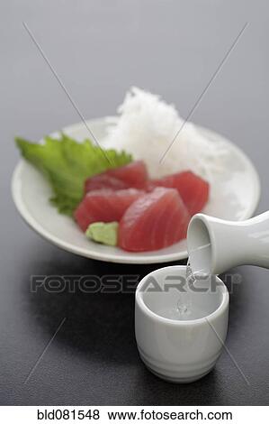 Tuna sashimi and sake View Large Photo Image Stock Photo - Tuna sashimi and sake. Fotosearch