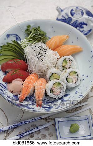 Stock Photograph - Variety of sushi rolls and sashimi in bowl. Fotosearch