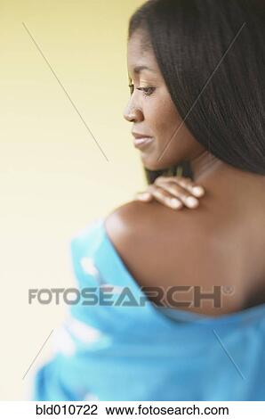 African American woman looking over shoulder View Large Photo Image Stock Image - African American woman looking over shoulder. Fotosearch