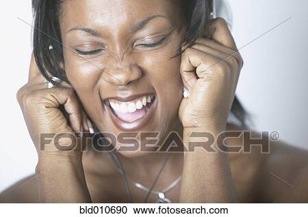 African American woman singing and wearing headphones View Large Photo Image Stock Image - African American woman singing and wearing headphones. Fotosearch