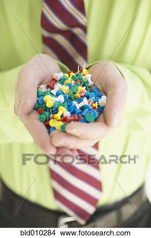 Businessman holding push pins View Large Photo Image Picture - Businessman holding push pins. Fotosearch