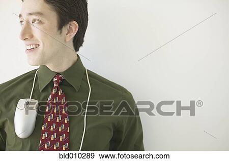 Businessman with computer mouse around neck View Large Photo Image Stock Photo - Businessman with computer mouse around neck. Fotosearch