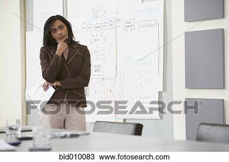Stock Image - Businesswoman contemplating. Fotosearch