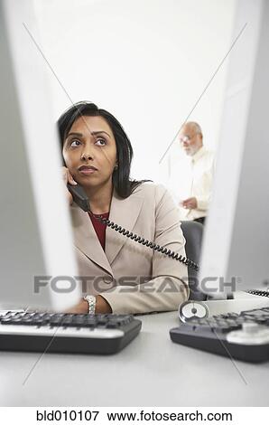 Businesswoman using telephone View Large Photo Image Stock Photo - Businesswoman using telephone. Fotosearch