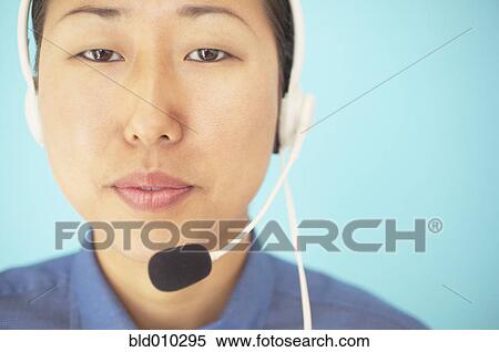 Stock Photography - Businesswoman wearing a headset. Fotosearch