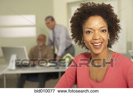 Stock Photo - Businesswoman with background businessmen. Fotosearch