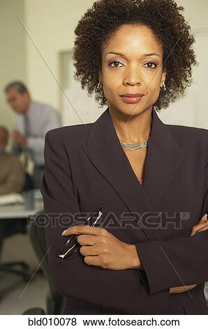 Stock Photo - Businesswoman with background businessmen. Fotosearch