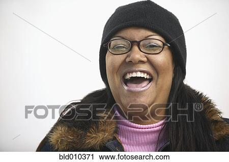 Stock Image - Close up of a happy woman. Fotosearch