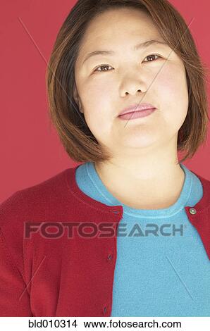Picture - Close up of a woman thinking. Fotosearch