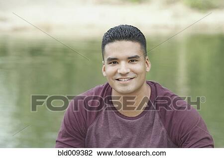 Close up of a young man smiling View Large Photo Image Stock Image - Close up of a young man smiling. Fotosearch