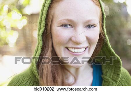 Close up of a young woman in green hood View Large Photo Image Stock Image - Close up of a young woman in green hood. Fotosearch