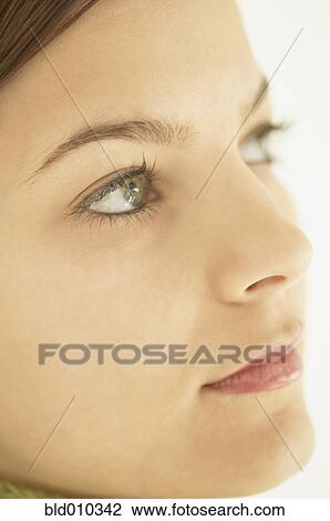 Stock Image - Close up of a young woman's face. Fotosearch