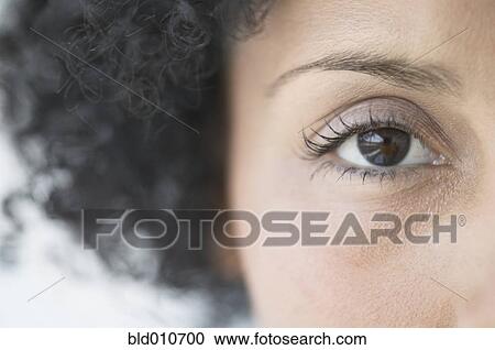 Stock Image - Close up of African American woman's eye. Fotosearch