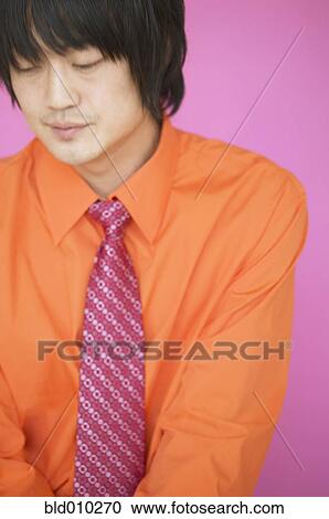 Close up of businessman looking down View Large Photo Image Stock Image - Close up of businessman looking down. Fotosearch