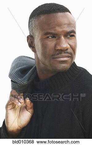 Stock Photo - Close up of man looking sideways. Fotosearch