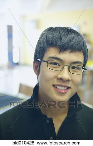 Stock Photo - Close up of teenage boy smiling. Fotosearch