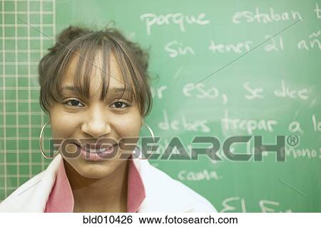 Close up of teenage girl and blackboard View Large Photo Image Stock Photograph - Close up of teenage girl and blackboard. Fotosearch