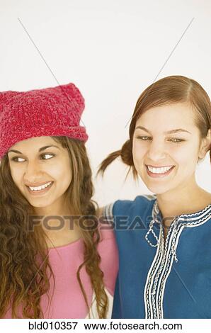 Close up of two smiling young women View Large Photo Image Stock Photo - Close up of two smiling young women. Fotosearch