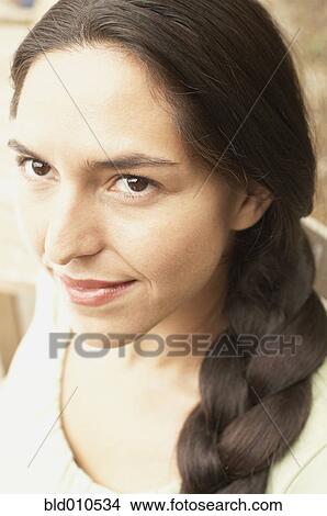 Close up of woman with braid View Large Photo Image Picture - Close up of woman with braid. Fotosearch