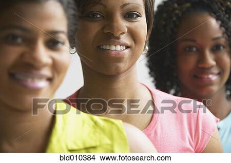 Close up of women standing in a row View Large Photo Image Picture - Close up of women standing in a row. Fotosearch