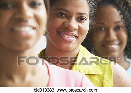 Close up of women standing in a row View Large Photo Image Stock Image - Close up of women standing in a row. Fotosearch