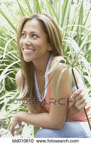 Close up of young woman smiling View Large Photo Image Stock Image - Close up of young woman smiling. Fotosearch