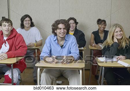 Stock Image - High school students sitting in classroom. Fotosearch