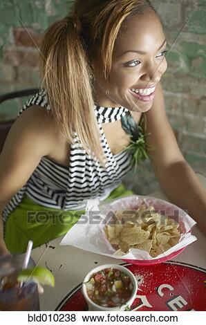Stock Photo - Looking down at woman in a restaurant. Fotosearch