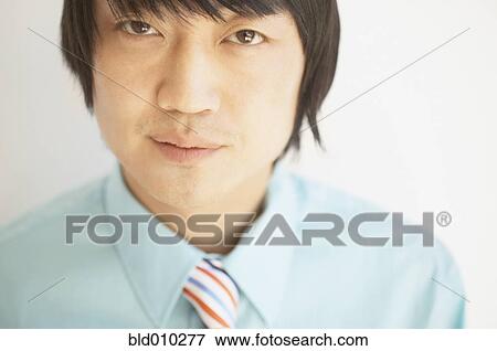 Stock Photo - Portrait of a businessman smiling. Fotosearch