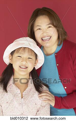 Stock Image - Portrait of a mother and her daughter . Fotosearch