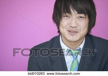 Stock Image - Portrait of a smiling businessman. Fotosearch