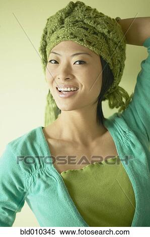 Portrait of a smiling young woman View Large Photo Image Stock Photography - Portrait of a smiling young woman. Fotosearch