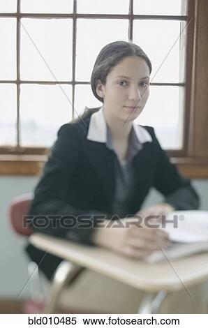 Portrait of a teenage girl in a classroom View Large Photo Image Stock Photography - Portrait of a teenage girl in a classroom. Fotosearch