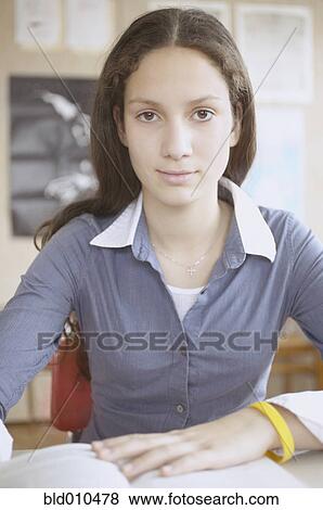 Stock Photo - Portrait of a teenage girl smiling. Fotosearch