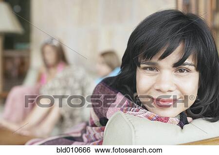Portrait of a woman wrapped in blanket View Large Photo Image Stock Photograph - Portrait of a woman wrapped in blanket. Fotosearch
